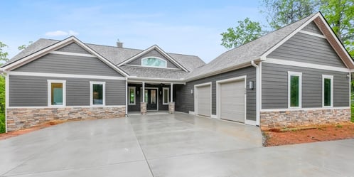 A custom home with gray and white exterior.