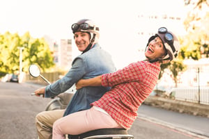 empty nesters riding a bike