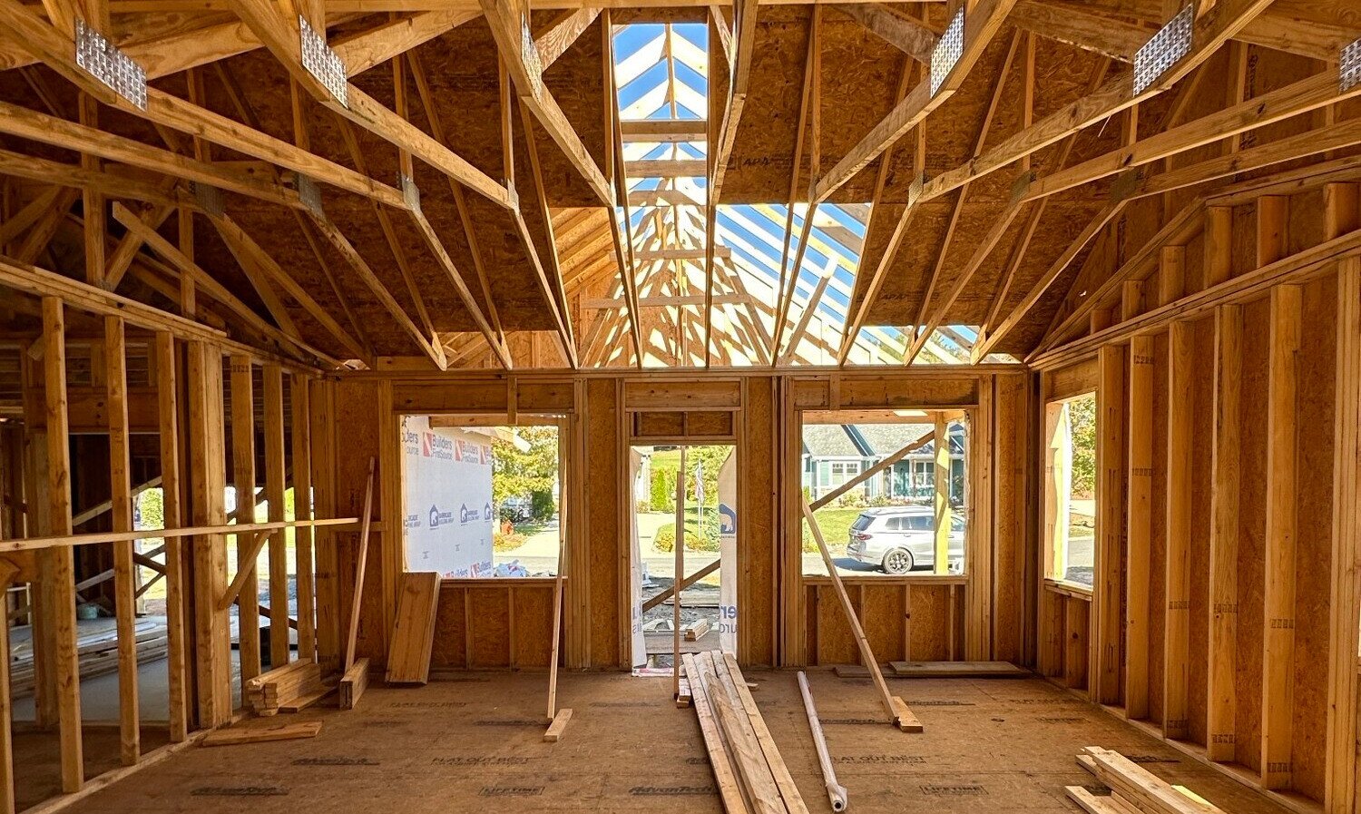 A home that is in the construction process with wood framing.