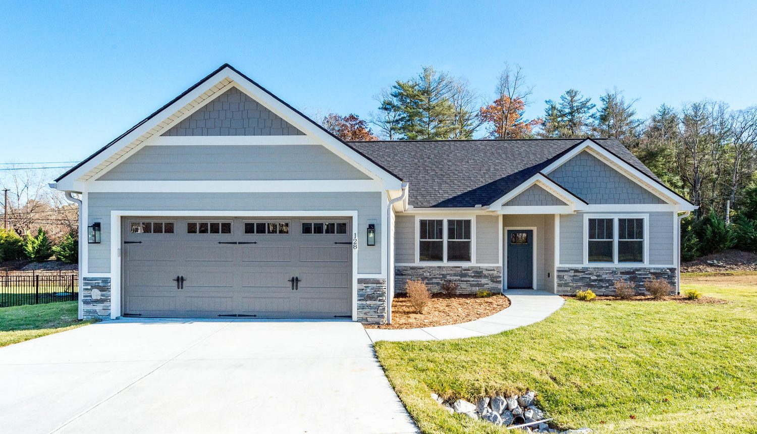 The Dogwood is a one-story custom home floorplan design with a specious garage and plenty of room for the family in Western North Carolina.