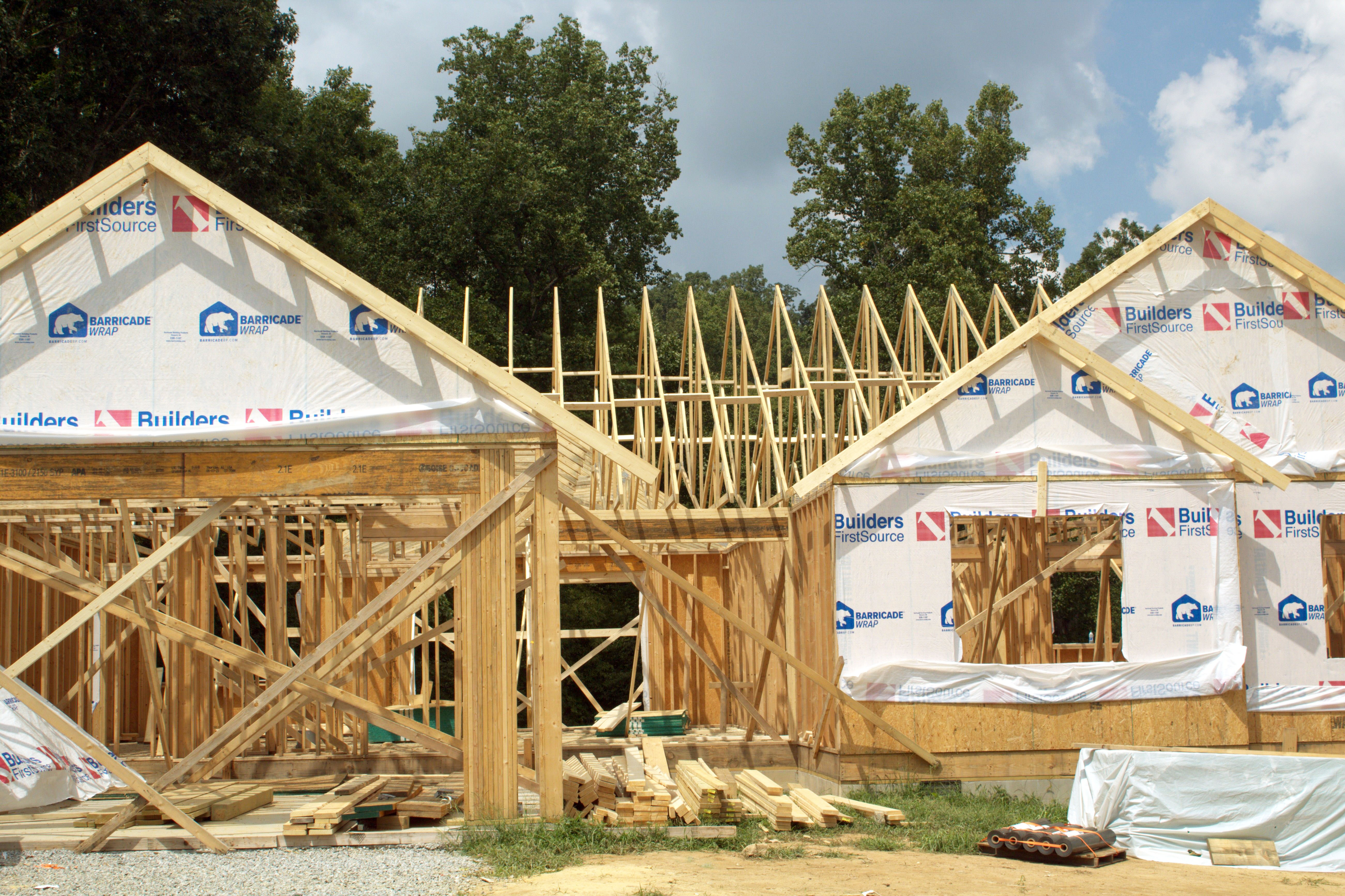 A home is being built and is currently as the stage where it's a skeleton of wood planks