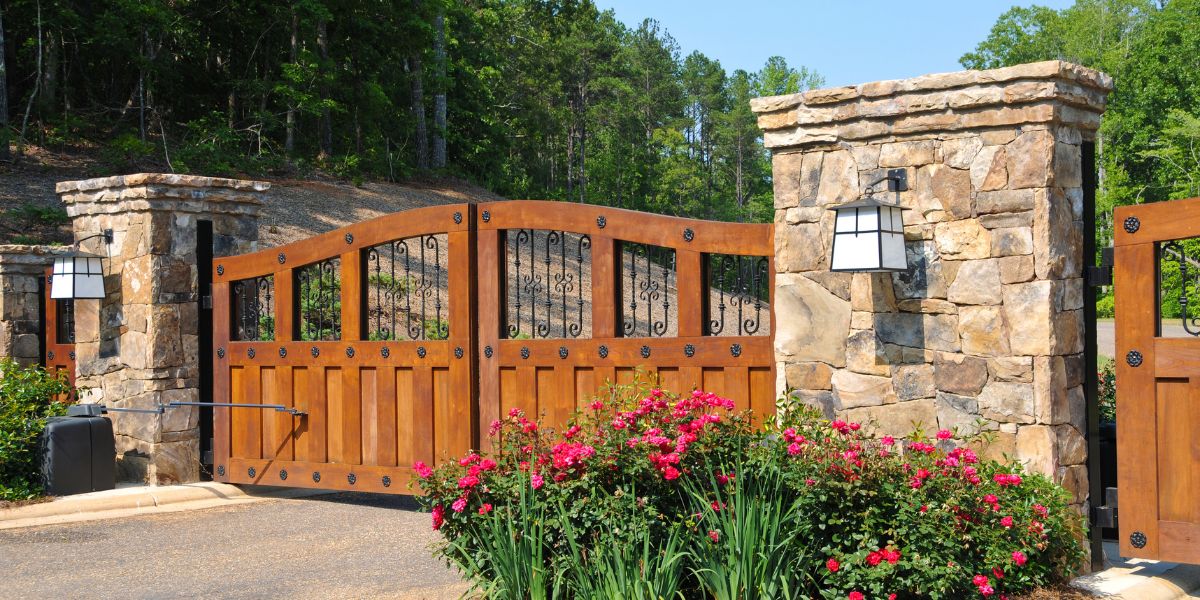 A gated community has beautiful wooden gates protecting the neighborhood